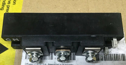 Mitsubishi CM75DY-12H Power Module Inverter. Black plastic housing with metal terminals, industrial automation part.