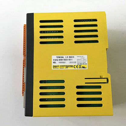 FANUC A03B-0823-C011 Terminal I/O Basic Module, yellow component with label showing details.