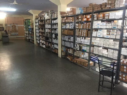 Warehouse shelves stocked with Mitsubishi MR-J4-20B-RJ Servo Drive parts, in boxes ready for fast shipping.