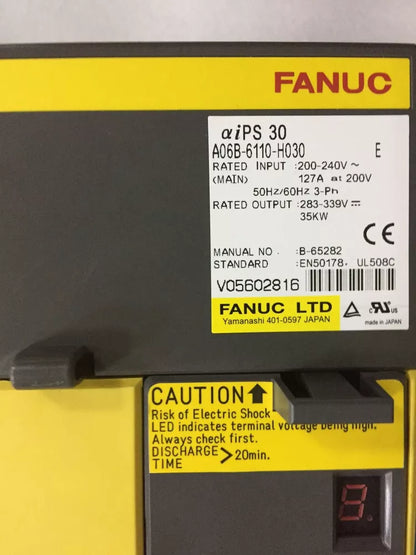 FANUC A06B-6110-H030 Servo Amplifier, industrial equipment with caution label, 35kW output, expandable shipping.