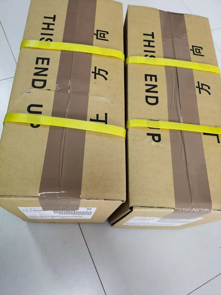 FANUC A06B-0034-B175#0008 Servo Motor boxes, brown carton, 'This End Up' label, yellow straps.