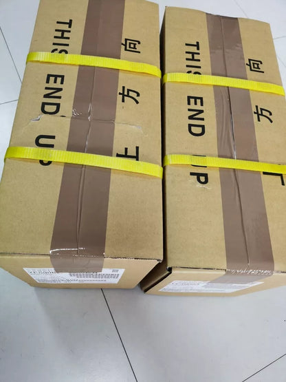 FANUC A06B-0034-B175#0008 Servo Motor boxes, brown carton, 'This End Up' label, yellow straps.