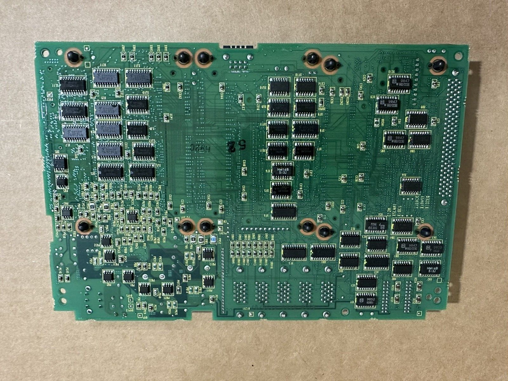 FANUC A20B-8100-0135 Main Board PCB. Green circuit board with various electronic components, automation part.