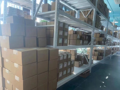 Warehouse shelves filled with boxes of industrial automation parts, ready for shipping, B&R I/O module stock.