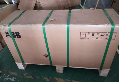 ABB ACS880-01 VFD in a cardboard box, secured with green straps, ready for shipping.