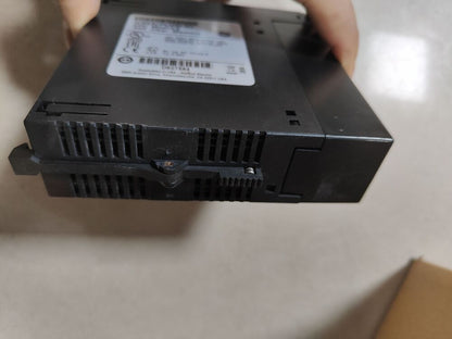 FANUC IC693CPU350 CPU module in hand, black industrial automation part, product code DB27584