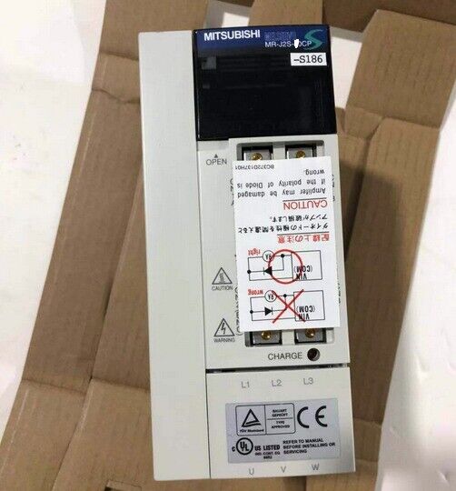 Mitsubishi MR-J2S-200CP-S186 servo driver. Features labels, warnings, terminal markings L1, L2, L3, U, V, W.