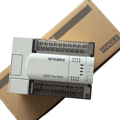 Mitsubishi FX2N-16MR PLC, white PLC unit with indicators, on cardboard box, labeled MITSUBISHI.