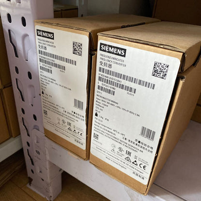 Siemens MICROMASTER 440 frequency converter boxes, 6SE6440-2UD15-5AA1 industrial automation parts, with product labels.