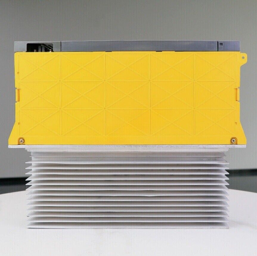 FANUC A06B-6077-H106 Servo Drive - Yellow casing, with silver heat sink, industrial automation part