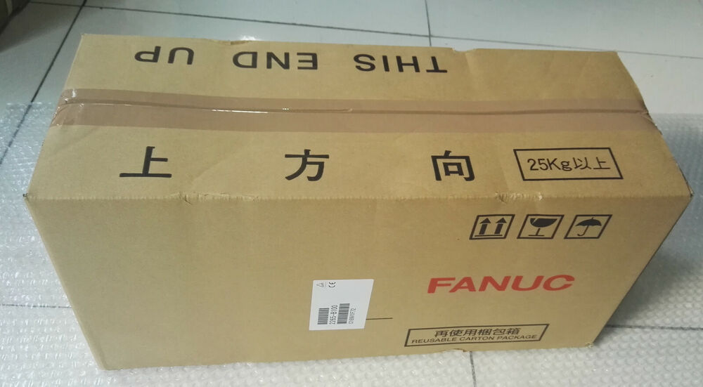 FANUC Servo Motor shipping box, brown cardboard, 'THIS END UP', '25Kg+', reusable carton package