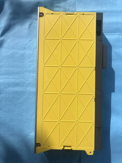 FANUC A06B-6079-H203 servo drive amplifier, yellow cover, industrial automation equipment.