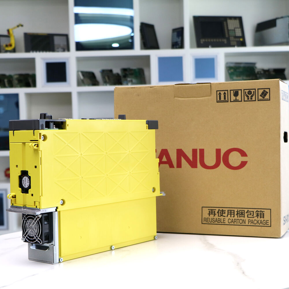 FANUC A06B-6220-H015#H600 Servo Drive Amplifier. Yellow industrial automation component with box.