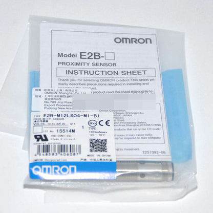 Omron E2B-M12LS04-M1-B1 proximity sensor in packaging, with instruction sheet, fast shipping.