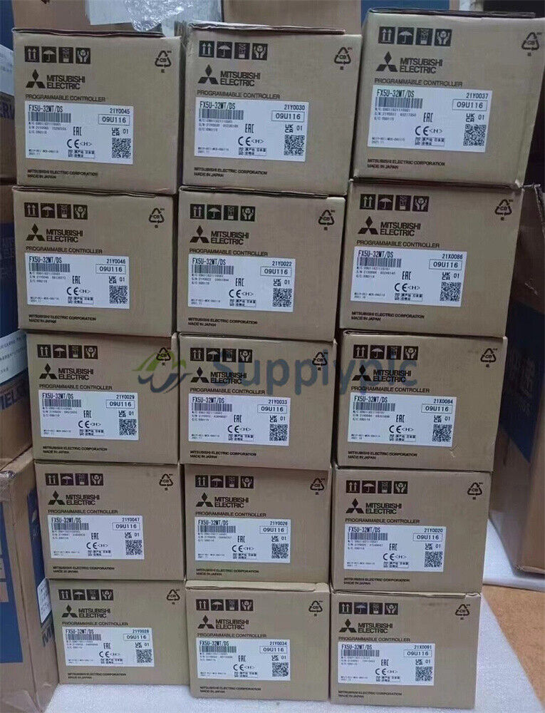 Mitsubishi FX5U-32MT/DS programmable controllers in boxes, industrial automation parts.