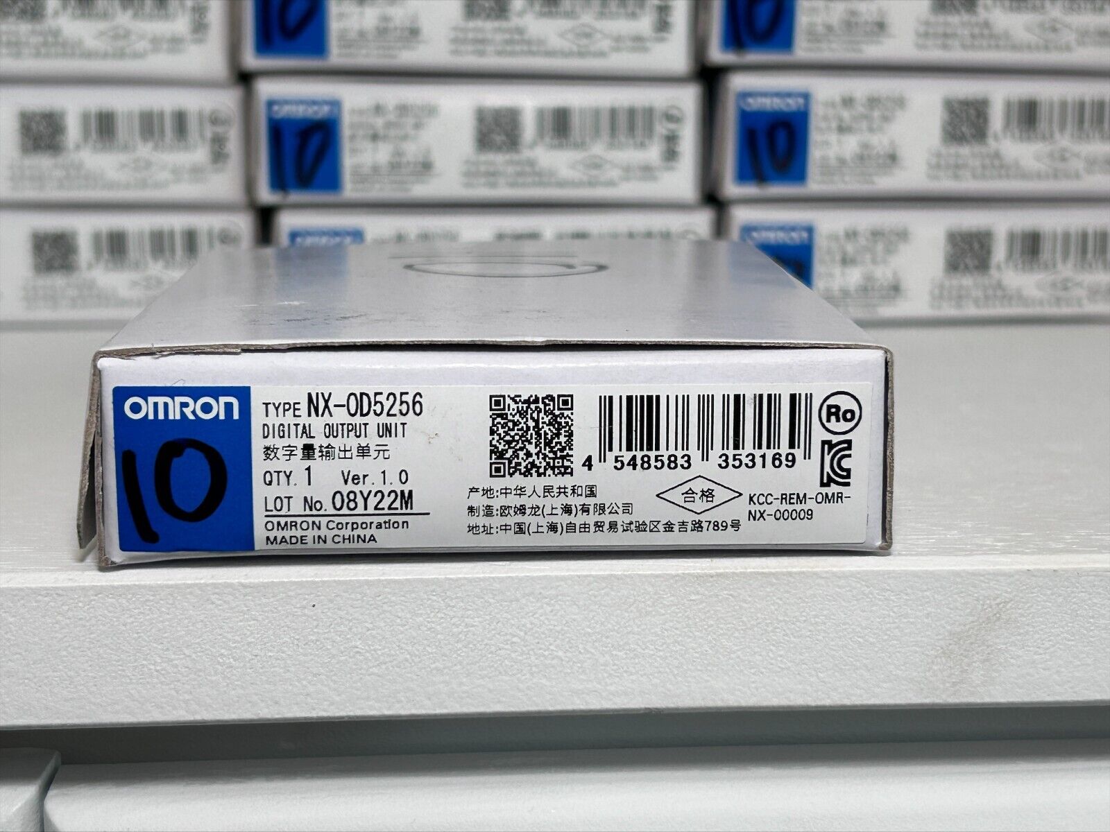 Omron NX-OD5256 Digital Output Unit - New Factory Sealed with product details printed on the box.