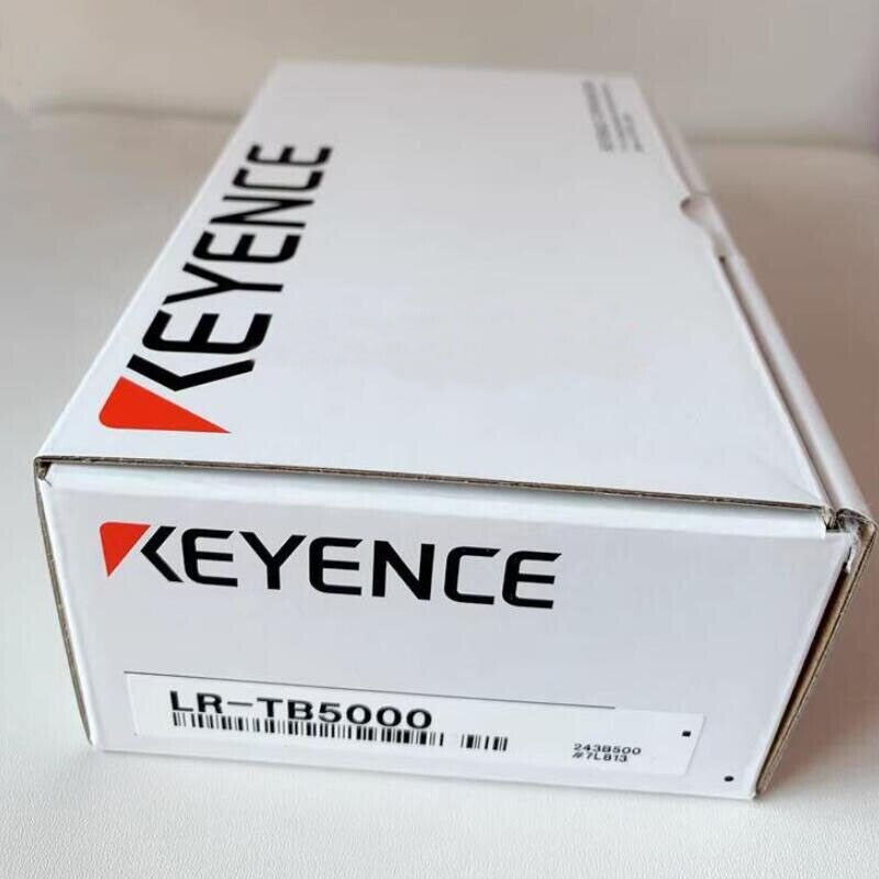 Keyence LR-TB5000 sensor in box, white packaging with black and red logo, product details label