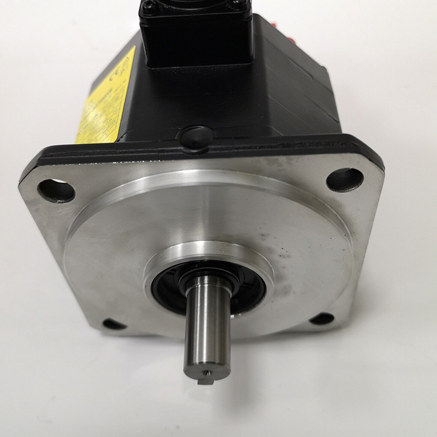 New FANUC A06B-0031-B075#0008 AC servo motor. Industrial automation part with metallic base and black housing.