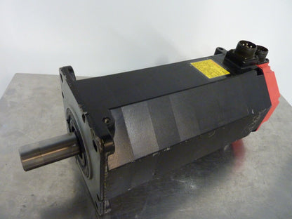 Fanuc AC Servo Motor A06B-0151-B077, industrial automation equipment, black and red color, with a metal shaft, 3.3kW 1200RPM