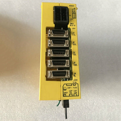 FANUC A02B-0259-C180 I/O board. Yellow industrial component with labels and ports for HMI systems.