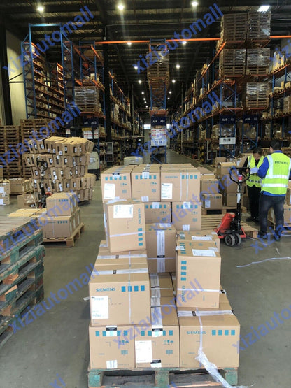 Siemens automation parts warehouse, pallets of boxed equipment, industrial automation components, servo motor parts