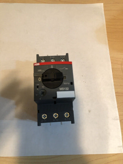 ABB MS132 motor protective circuit breaker, black and gray. Industrial automation equipment. Features MS132 label.