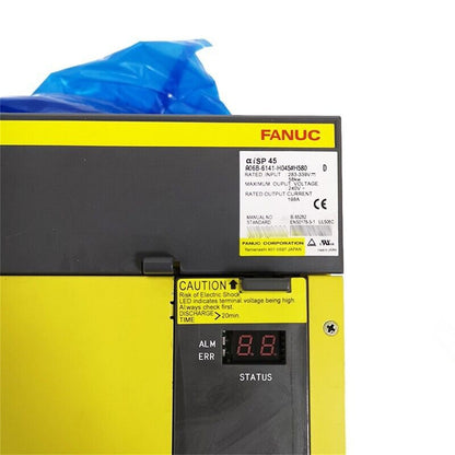 FANUC A06B-6141-H045#H580 spindle servo drive amplifier, yellow and black housing, Caution indicator, industrial part.