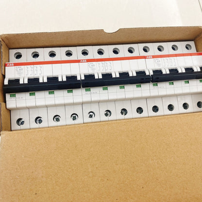 ABB S204 C40 circuit breakers in box. White and black components, PLC systems parts.