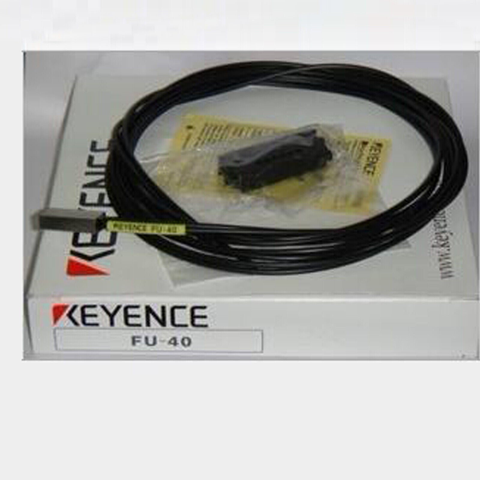 Keyence FU-40 Reflective Fiber Optic Sensor with black cable, product packaging.