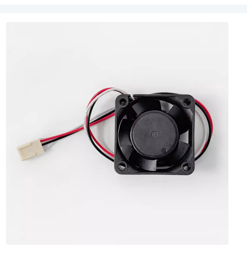 FANUC A90L-0001-0510 cooling fan, black blades and frame, with red, black, and white wires for PLC.