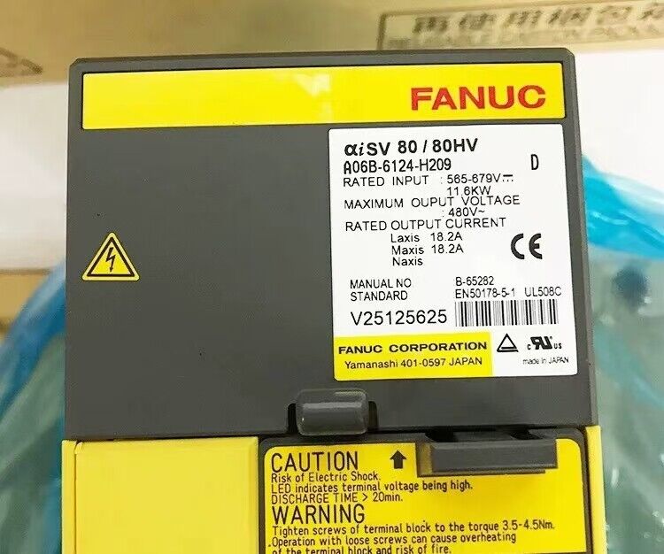 FANUC A06B-6124-H209 servo drive with warning labels, industrial automation part