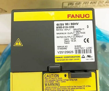 FANUC A06B-6124-H209 servo drive with warning labels, industrial automation part