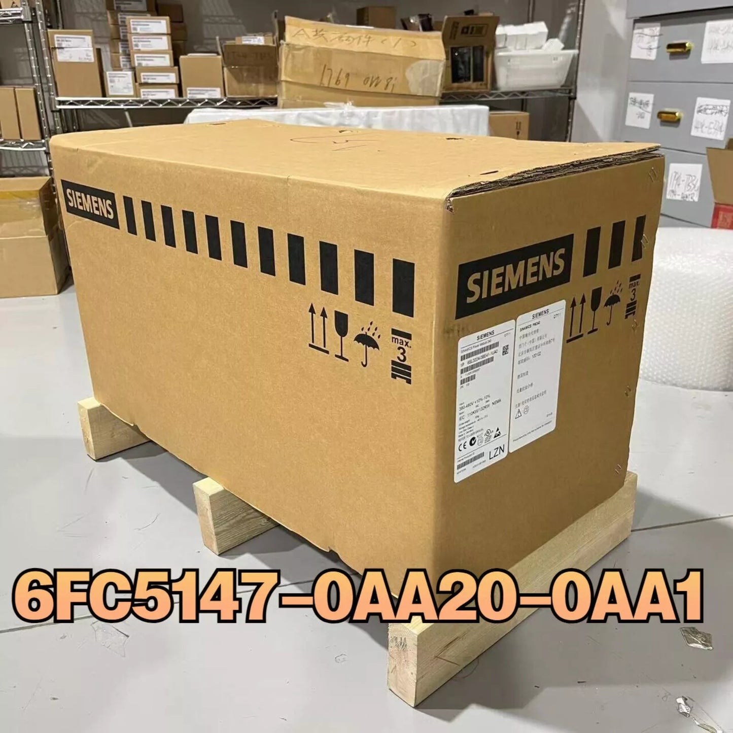 Siemens 6FC5147-0AA20-0AA1 PLC product packaging box, brown carton on wooden pallet.