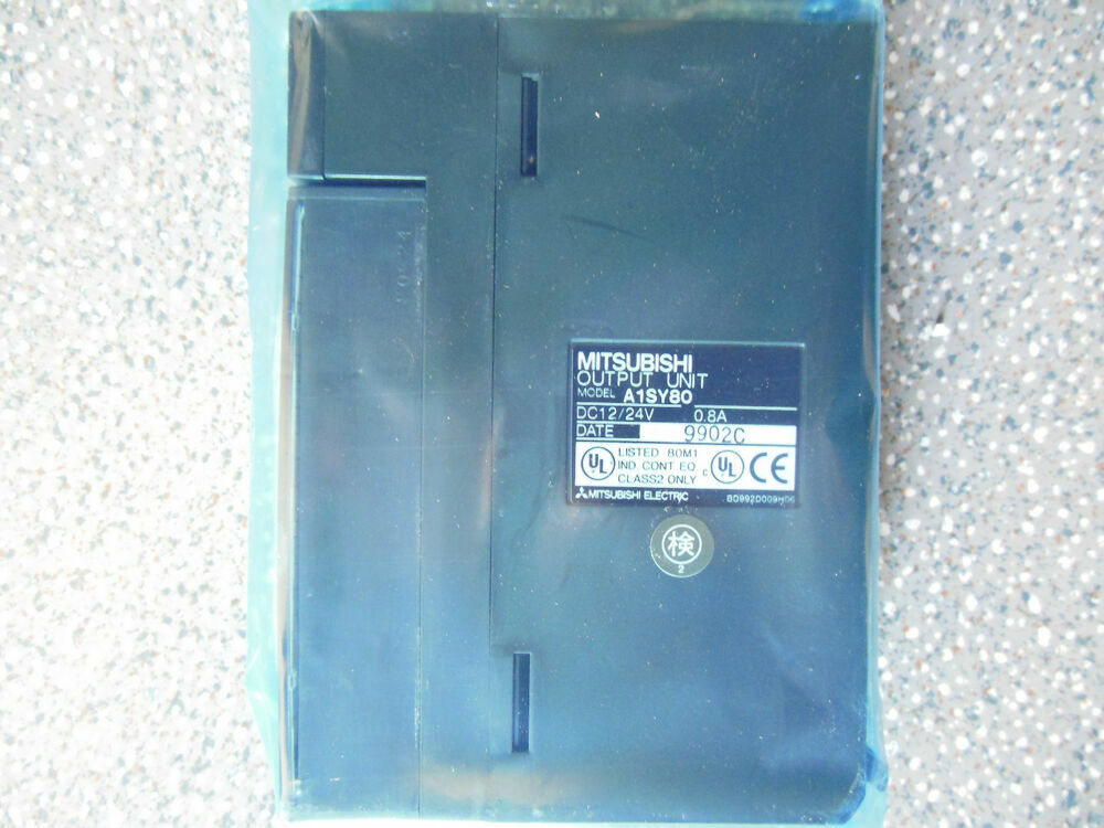 Mitsubishi A1SY80 PLC Output Unit Module, new in protective plastic. Black plastic, features product information.