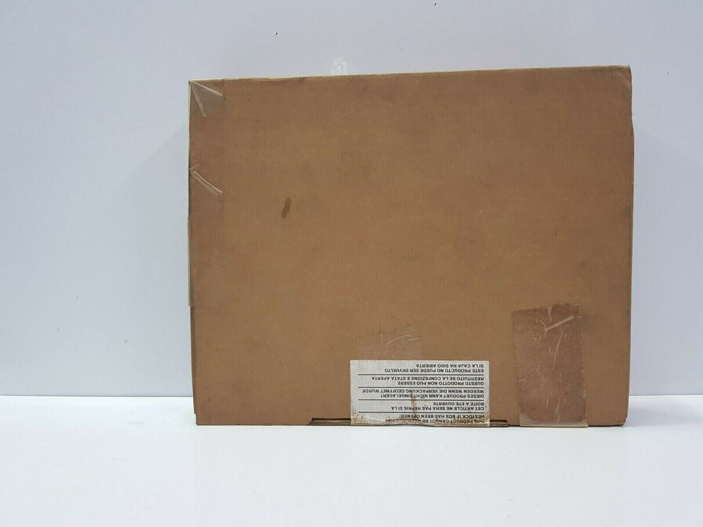 FANUC PLC product box, brown cardboard with warning label, new or refurbished PLC parts