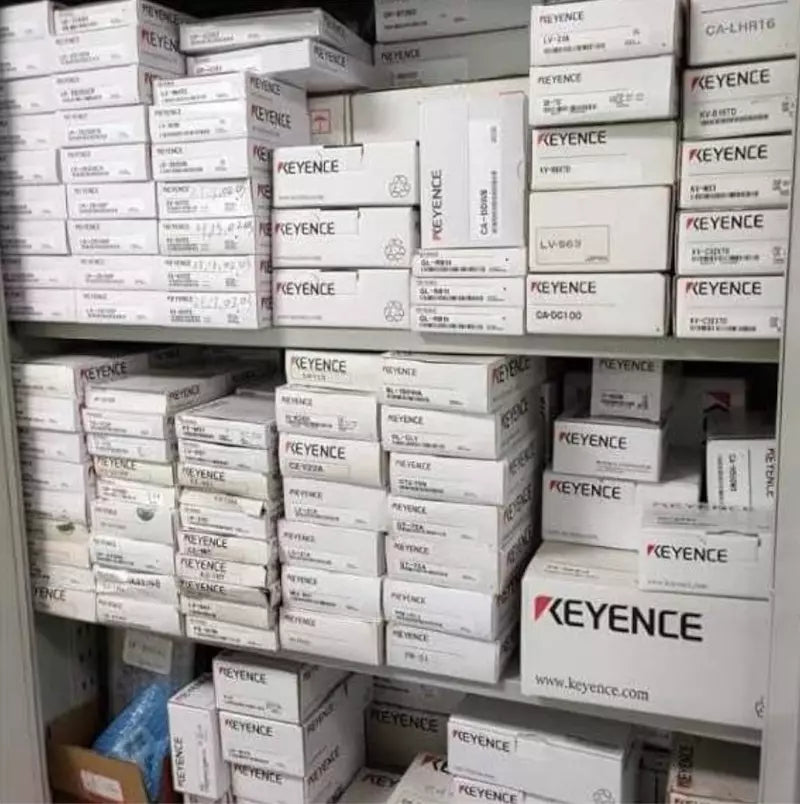 KEYENCE products inventory, industrial automation parts in stock, warehouse shelf.