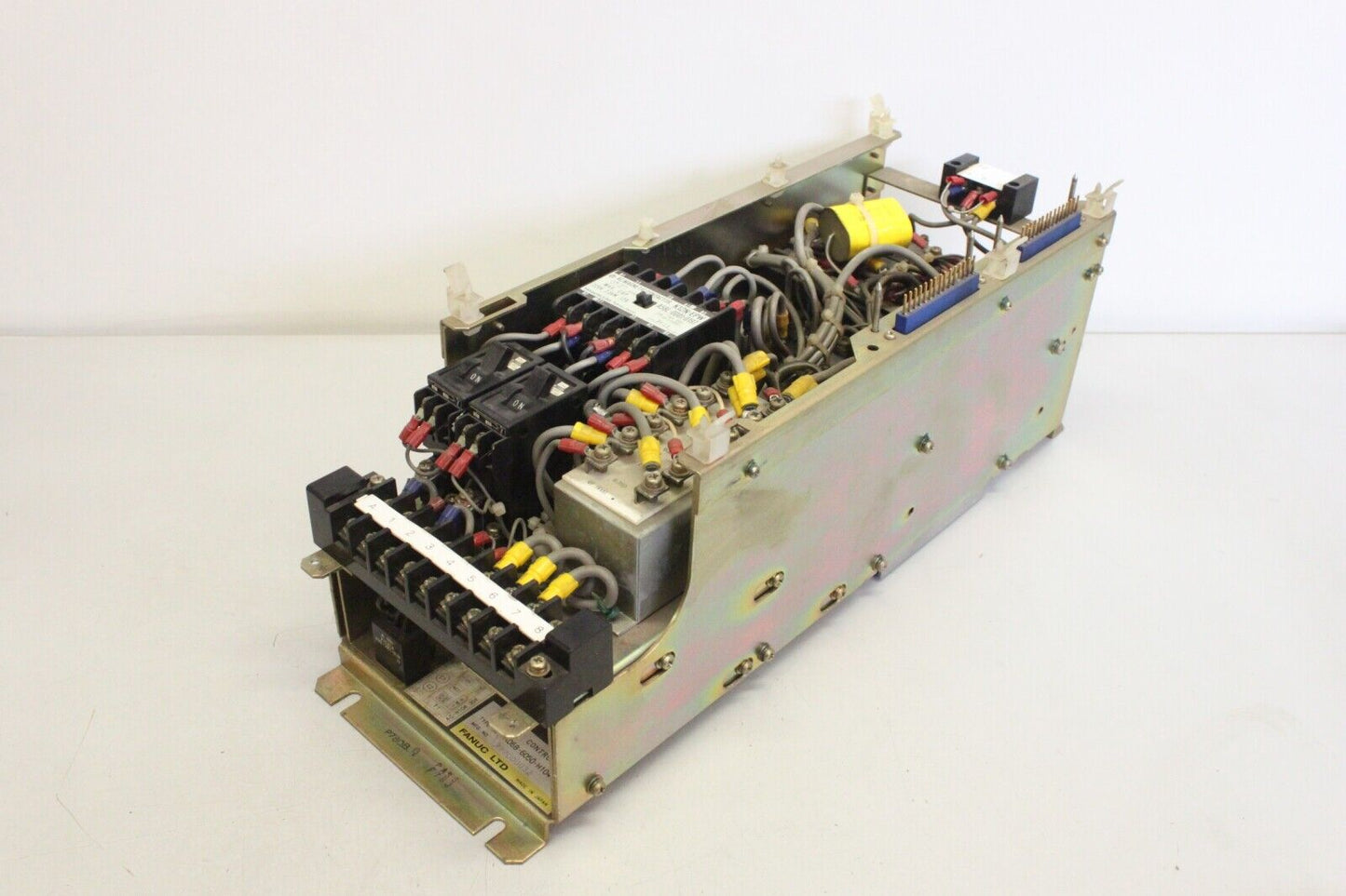 FANUC A06B-6050-H104 speed control unit, industrial automation spare part, internal view with wiring and components.
