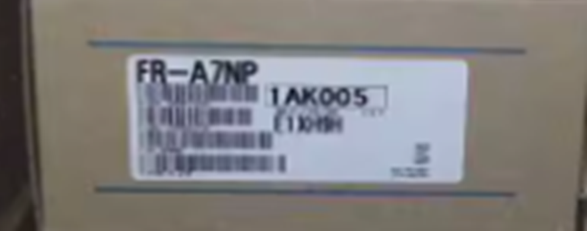 Mitsubishi FR-A7NP Inverter product label, showing model number and other details for industrial automation equipment.