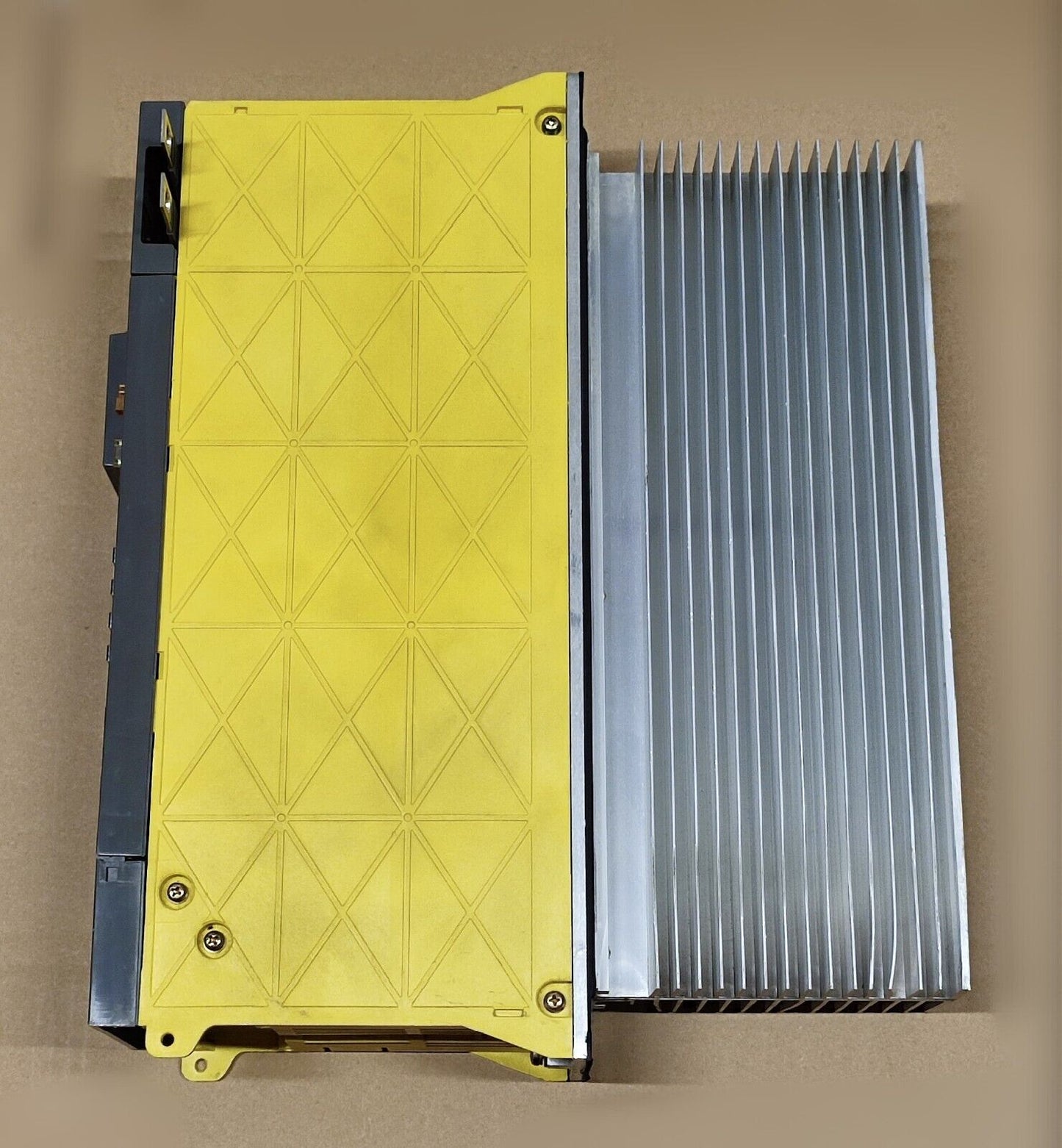 FANUC A06B-6096-H106#RA Servo Amplifier Module, yellow and silver with visible heat sink, industrial automation part