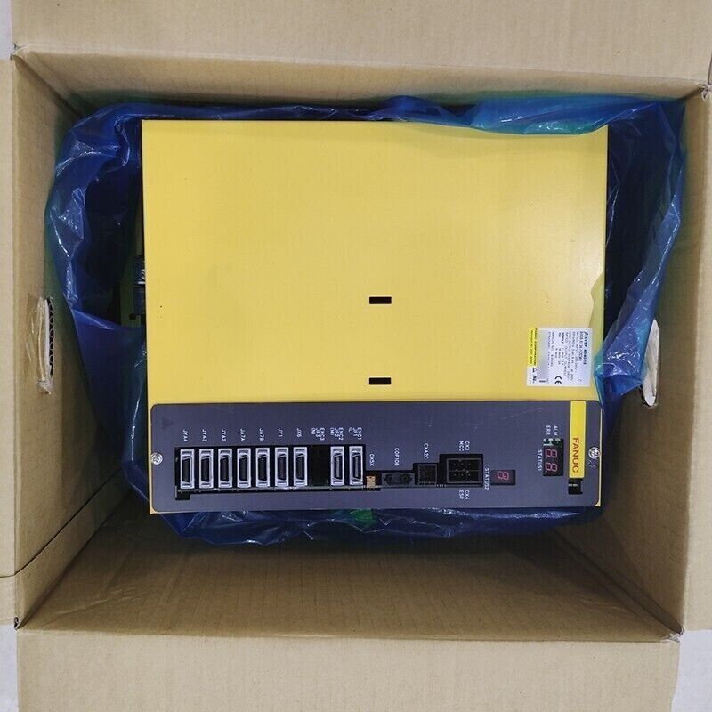 FANUC A06B-6134-H203#A Servo Driver Amplifier in box, yellow and black unit with digital display, CE mark.