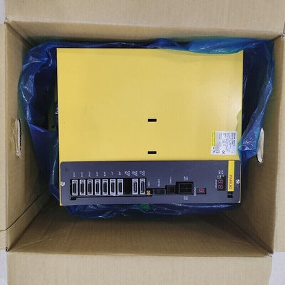 FANUC A06B-6134-H203#A Servo Driver Amplifier in box, yellow and black unit with digital display, CE mark.