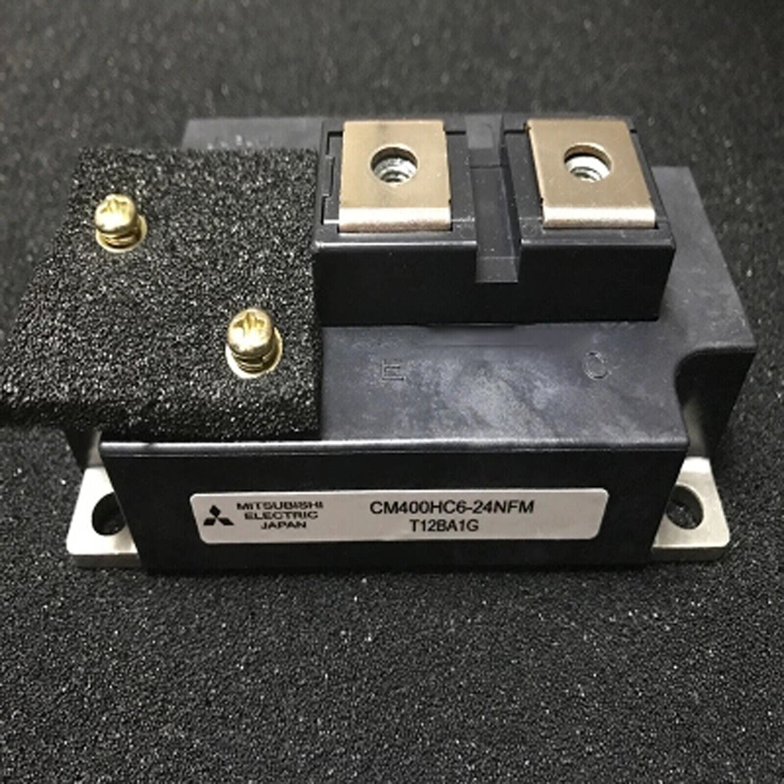 Mitsubishi CM400HC6-24NFM IGBT module, industrial automation part, black component with screws and metallic plates, Japan