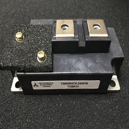 Mitsubishi CM400HC6-24NFM IGBT module, industrial automation part, black component with screws and metallic plates, Japan