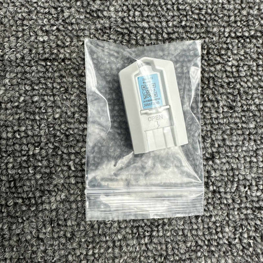 ABB ACS880-MU-ZCU-12/14 ZMU-02 Inverter Memory Card, inside of plastic bag on a gray carpet surface.