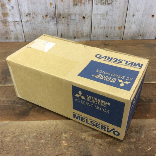 Mitsubishi MELSERVO AC Servo Motor box on a wooden surface