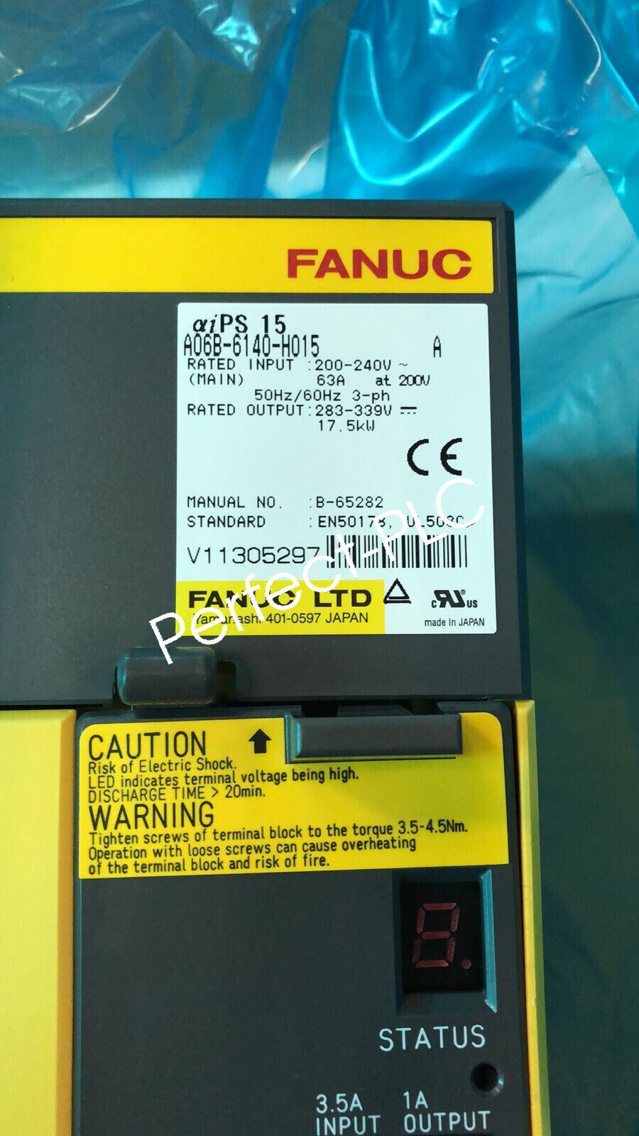FANUC A06B-6140-H015 servo driver. Black and yellow industrial equipment, new with label, part of automation.