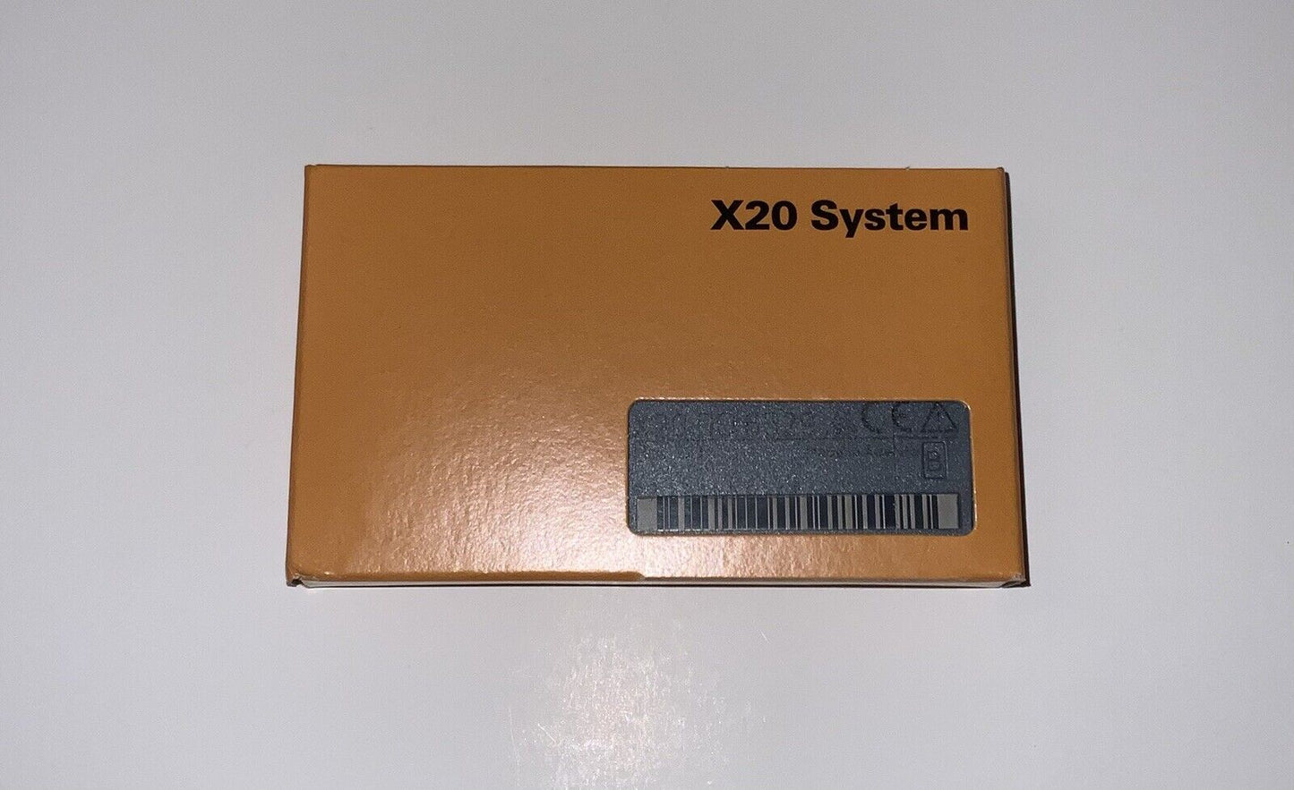 B&R X20 System Output Module, orange box with X20 System text, product for industrial automation.