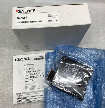 Keyence GC-S84 Safety I/O Unit in packaging, industrial automation component, with product details and manual.