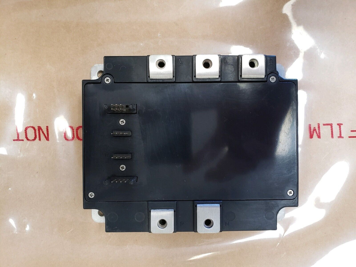 Mitsubishi PM150CVA120 IGBT Module, industrial automation part, black module with connectors, top view.