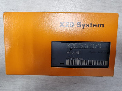 B&R X20 System BC 0073 PLC controller module in orange packaging, Rev. HO, Made in Austria. Industrial automation component.